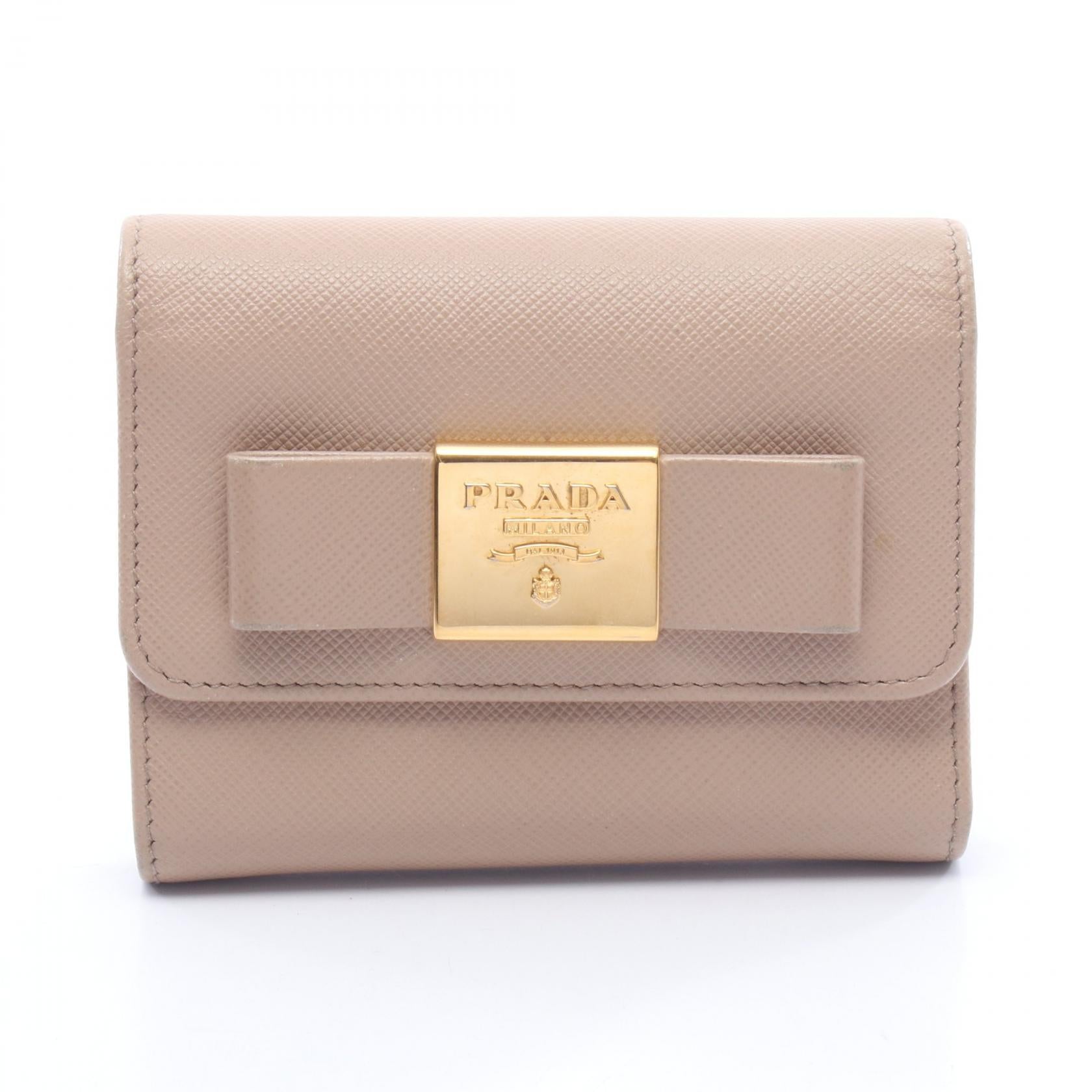 PRADA 三つ折財布 リボン 本革 【公式通販】