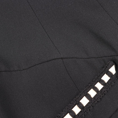 カメリアボタン ノーカラージャケット セットアップ スカートスーツ ウール シルク ブラック シャネル スーツ CHANEL