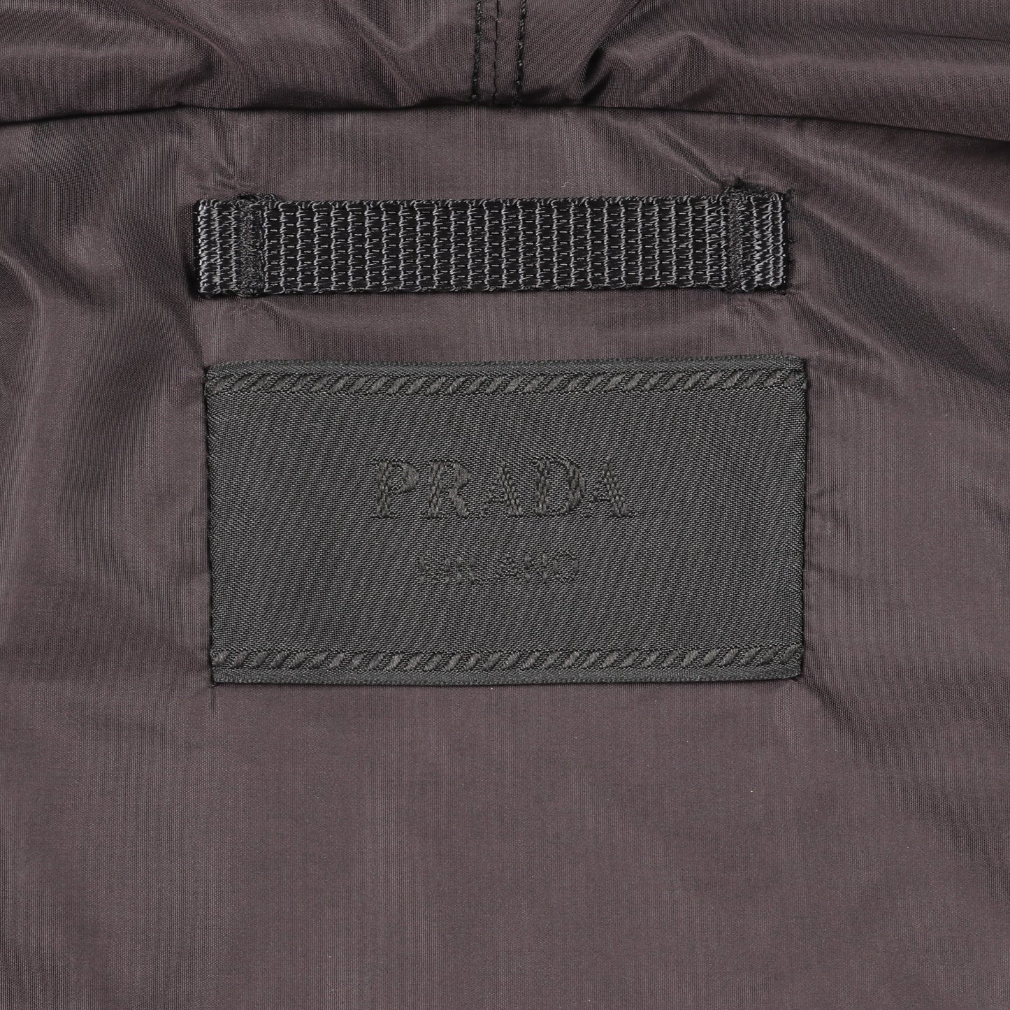 Re-Nylon ジップアップパーカー グラフィックプリント コットン オレンジ ブラック 三角プレート プラダ トップス PRADA