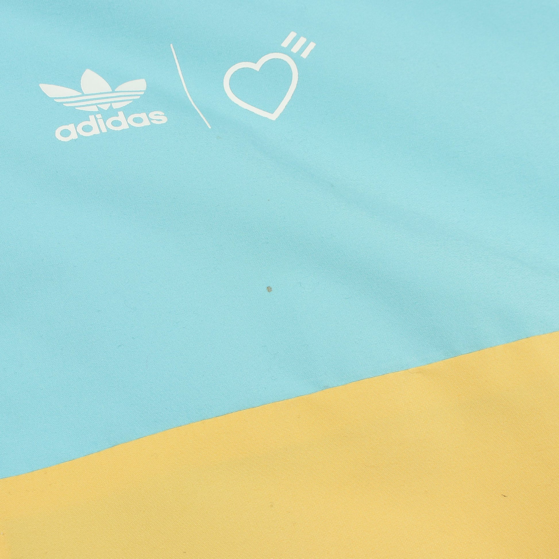 adidas × HUMAN MADE トラックジャケット ライトブルー イエロー フード付き アディダス アウター adidas