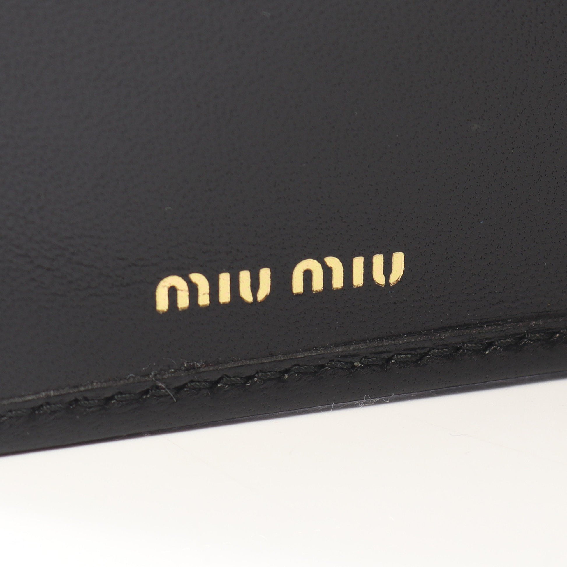 マテラッセ 二つ折り長財布 レザー ブラック ミュウミュウ 財布・小物 miu miu