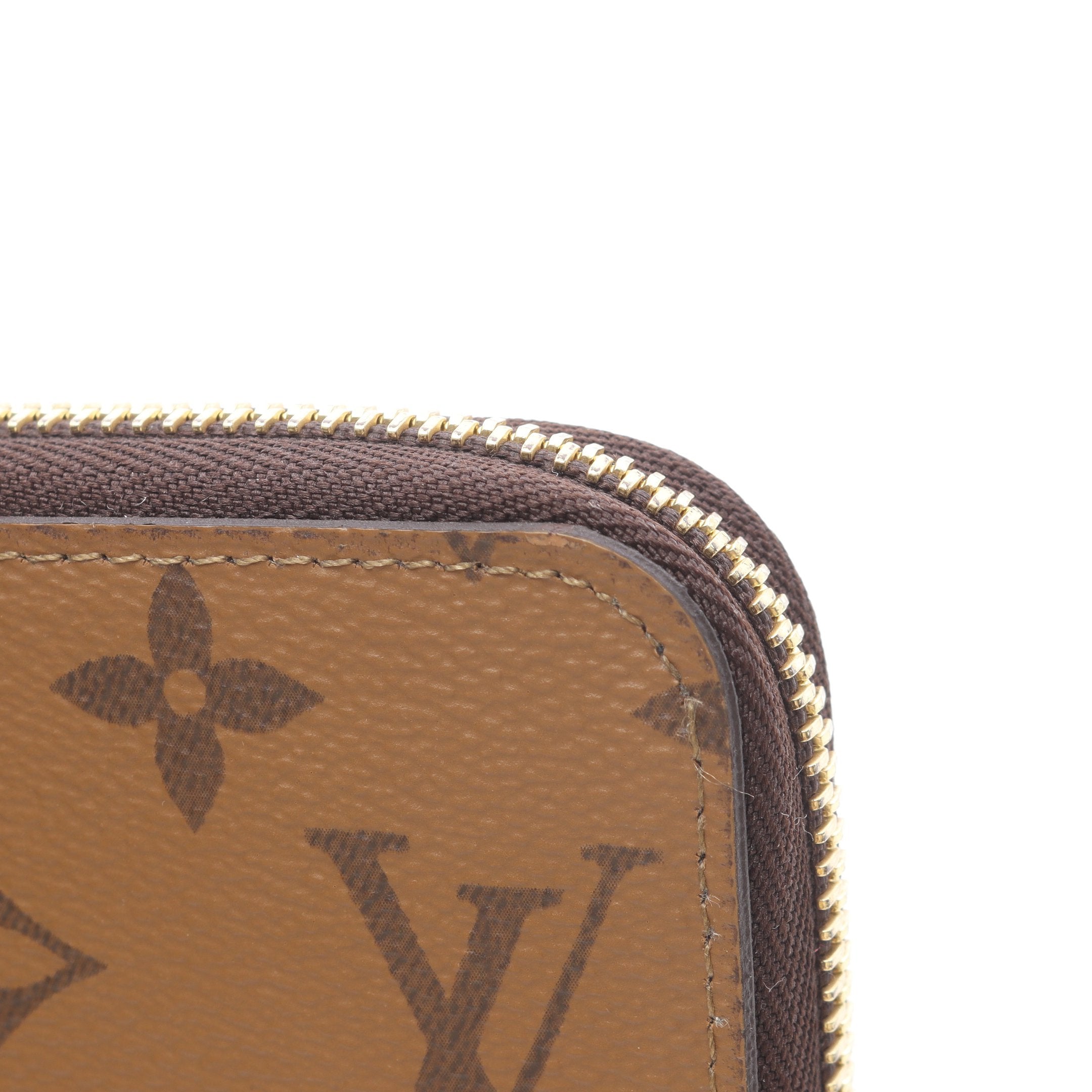 ジッピーウォレット モノグラムリバース ラウンドファスナー長財布 PVC