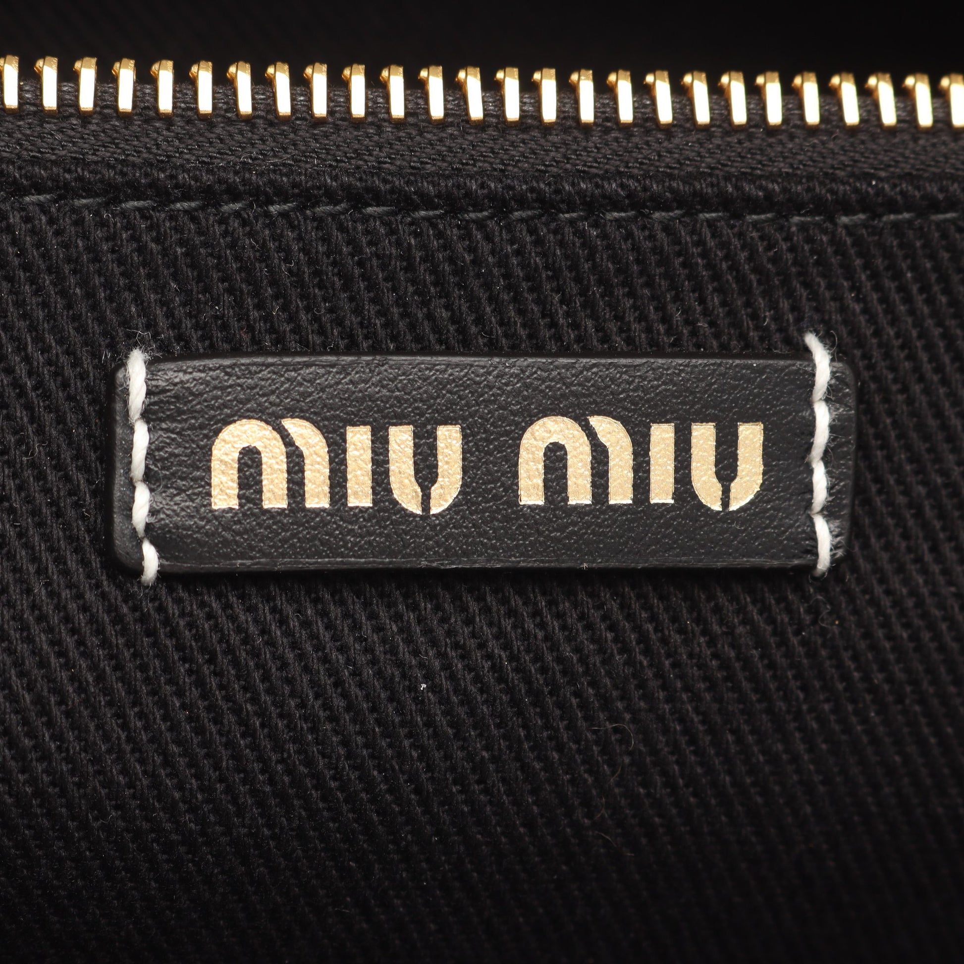 ロゴ ショルダーバッグ トートバッグ キャンバス レザー ホワイト ブラック ミュウミュウ バッグ miu miu